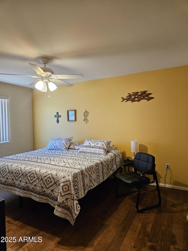 bedroom featuring a ceiling fan and wood finished floors