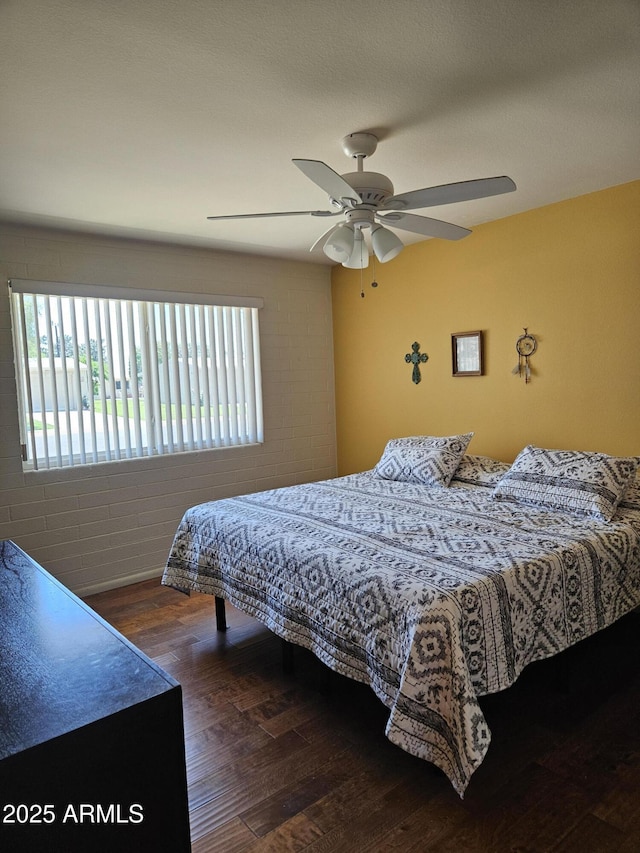 bedroom featuring wood finished floors and ceiling fan
