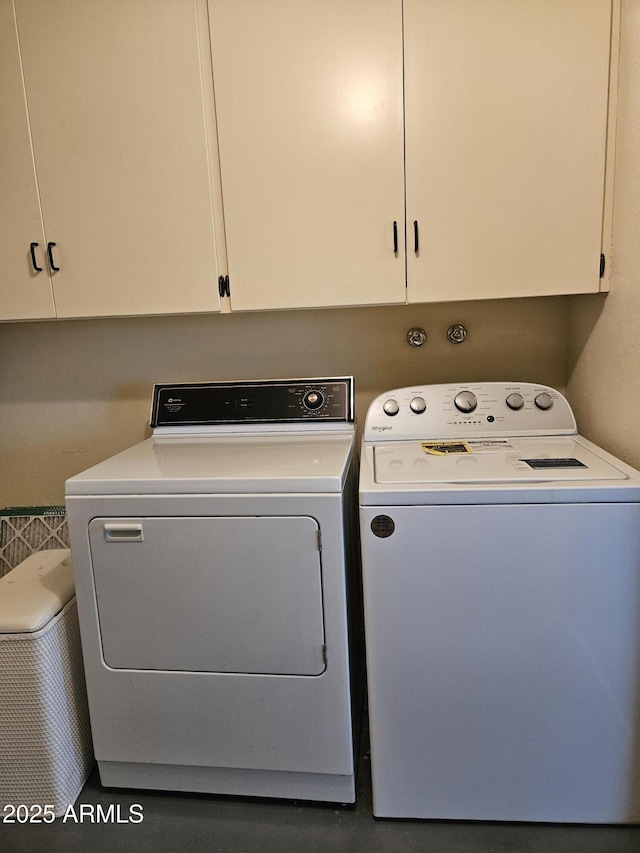 laundry area featuring cabinet space and washing machine and dryer