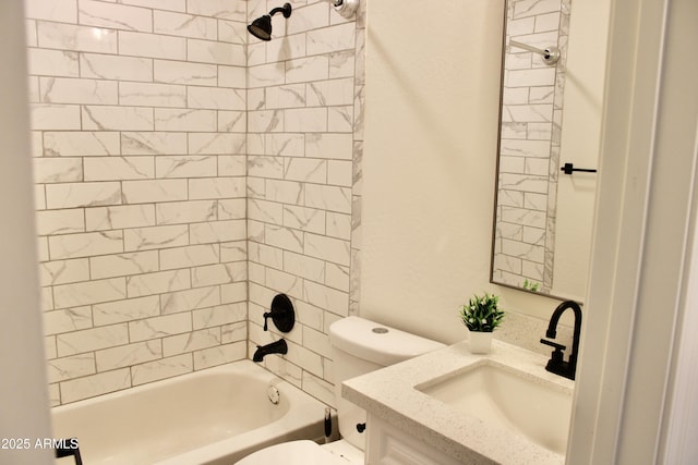 bathroom featuring toilet, tub / shower combination, and vanity