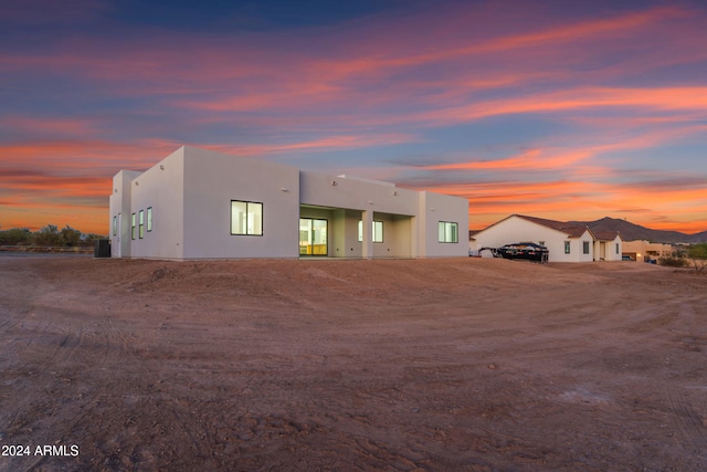 view of front of property featuring central air condition unit