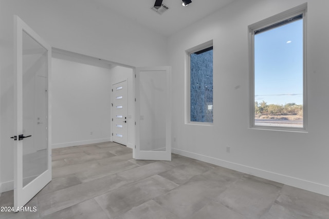 empty room featuring french doors