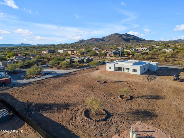 birds eye view of property with a mountain view