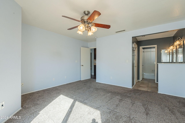 unfurnished room featuring ceiling fan and carpet floors