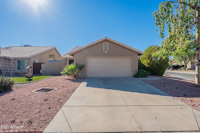 ranch-style house featuring a garage