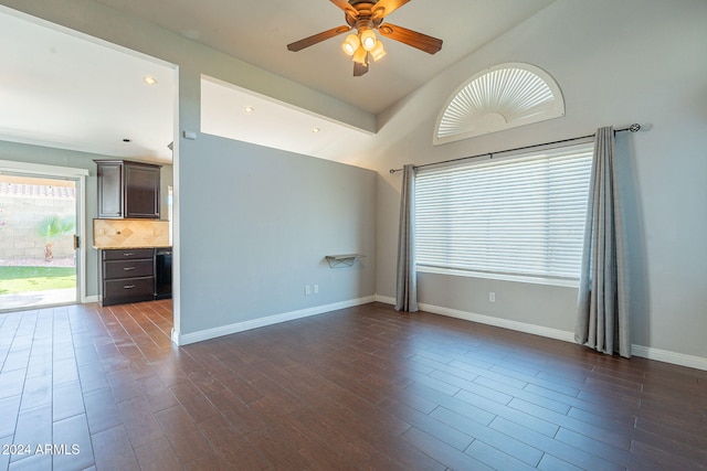 spare room with dark wood-type flooring and ceiling fan