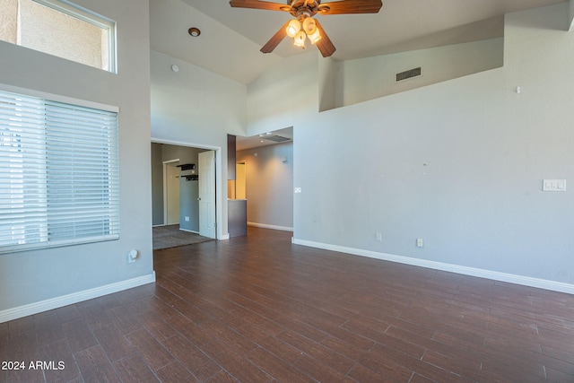 unfurnished room featuring ceiling fan, high vaulted ceiling, and dark hardwood / wood-style floors