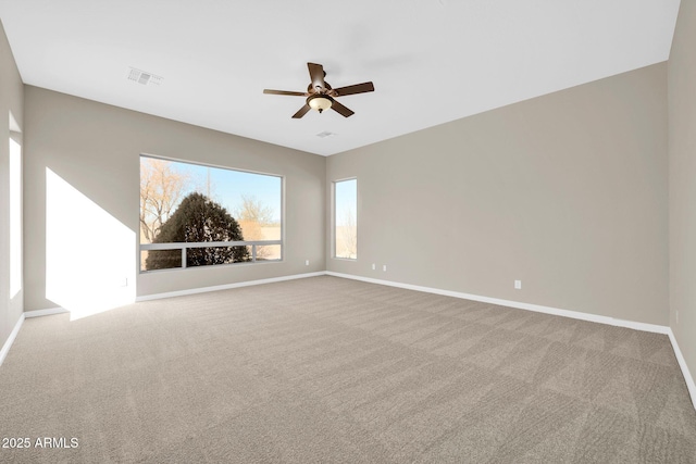 unfurnished room with carpet floors and ceiling fan