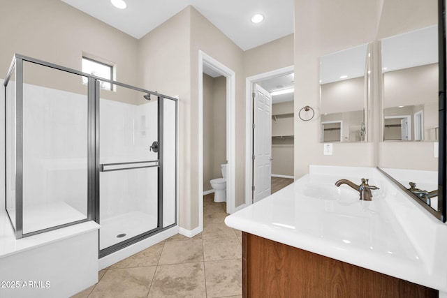 bathroom with vanity, an enclosed shower, tile patterned floors, and toilet