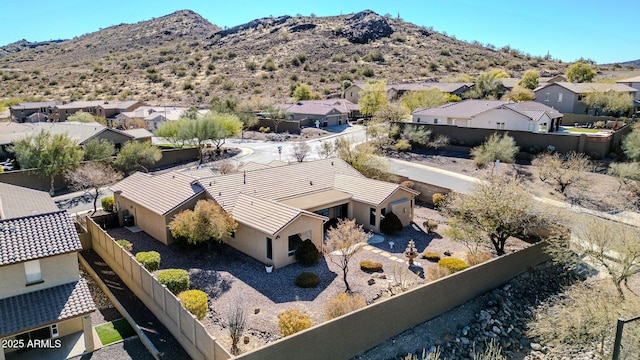 birds eye view of property with a mountain view