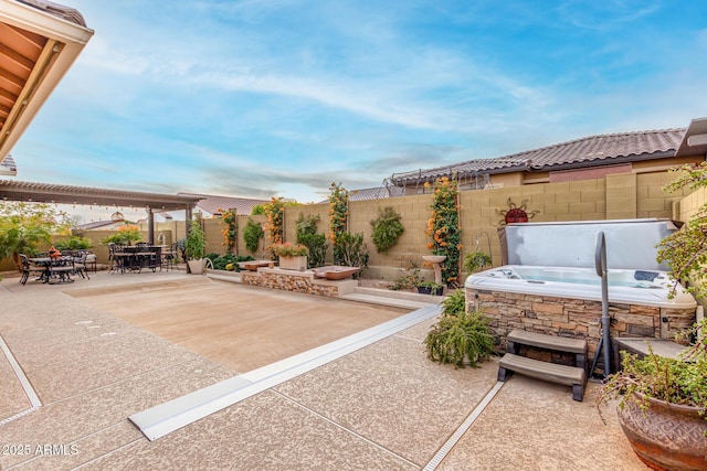 view of patio with a hot tub