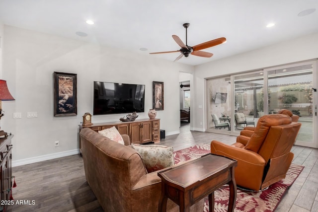 living room featuring hardwood / wood-style flooring, a wealth of natural light, and ceiling fan