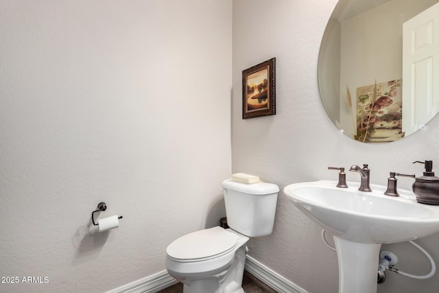 bathroom with toilet and sink