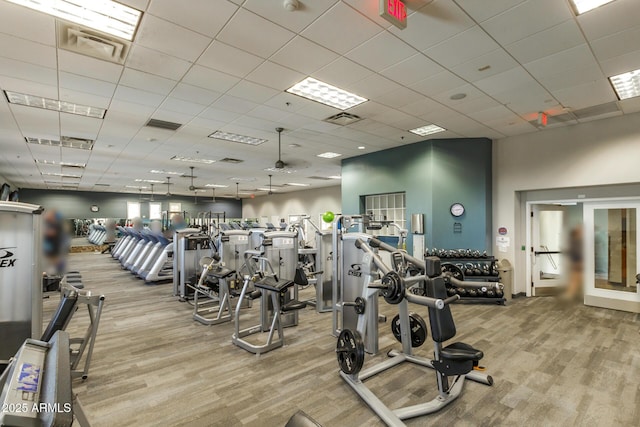 workout area featuring a paneled ceiling