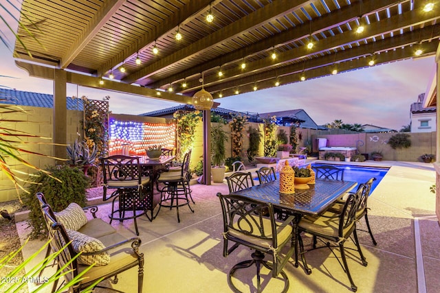 patio terrace at dusk with a fenced in pool and a pergola