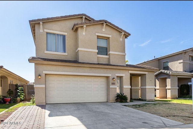 7117 W Globe Ave, Phoenix, AZ 85043 - traditional-style house featuring an attached garage, stucco siding, and concrete driveway