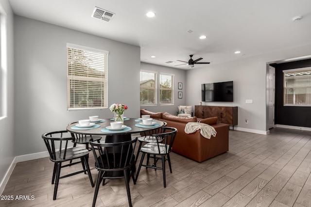 dining room with light wood-style flooring, recessed lighting, and visible vents