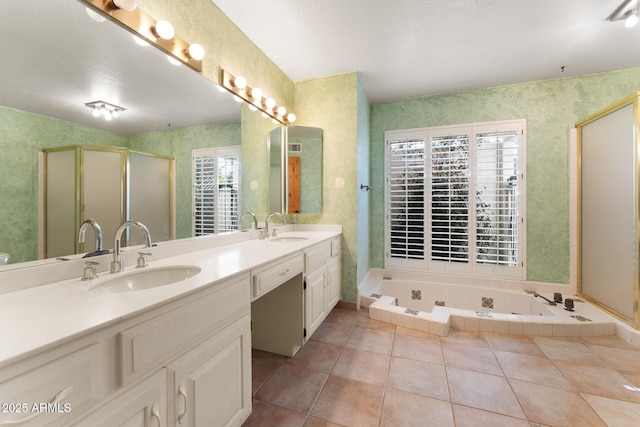 bathroom with tile patterned flooring, vanity, and shower with separate bathtub