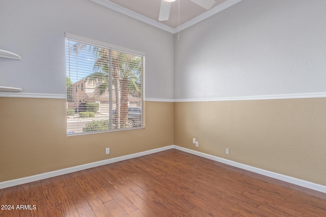 spare room with crown molding, ceiling fan, and wood-type flooring