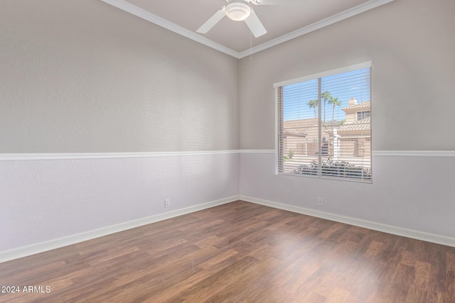 empty room with hardwood / wood-style flooring, ornamental molding, and ceiling fan