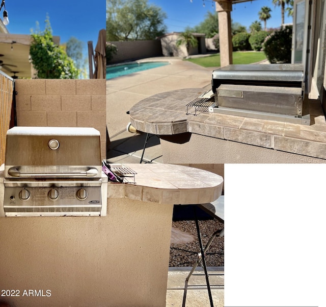 view of patio / terrace featuring area for grilling and exterior kitchen