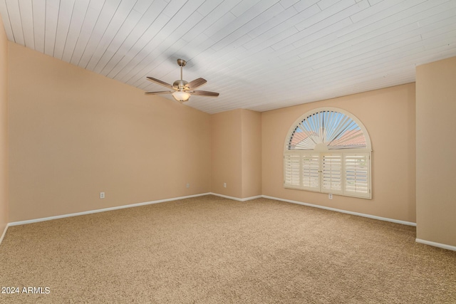 spare room featuring carpet flooring, ceiling fan, and wooden ceiling