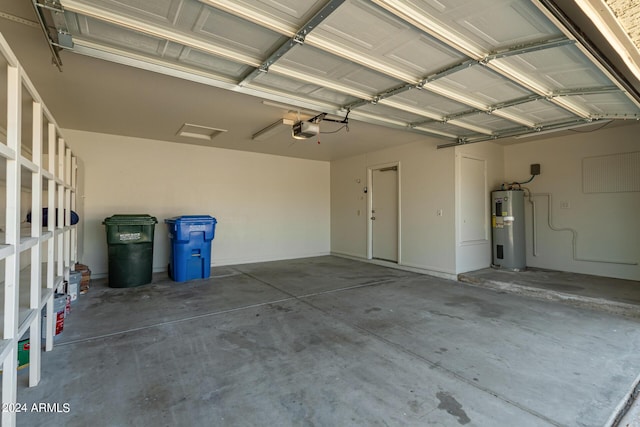 garage with electric water heater and a garage door opener