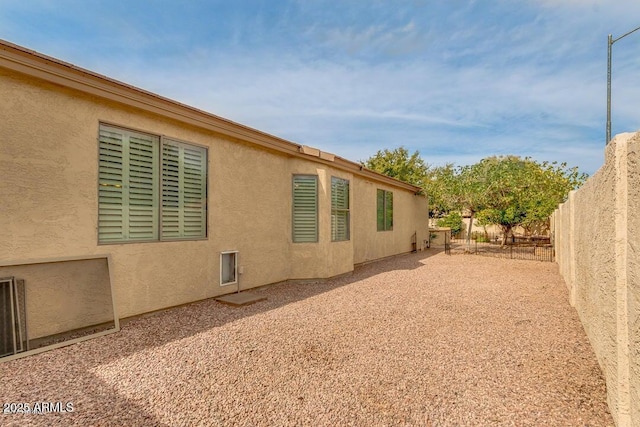 8210 W Wethersfield Rd, Peoria, AZ 85381 - view of side of property featuring a fenced backyard and stucco siding