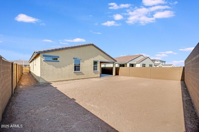 rear view of house featuring a patio