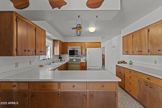 1455 W Kenrick Dr, Wickenburg, AZ 85390 - kitchen featuring freestanding refrigerator, stainless steel microwave, electric range, light countertops, and a peninsula