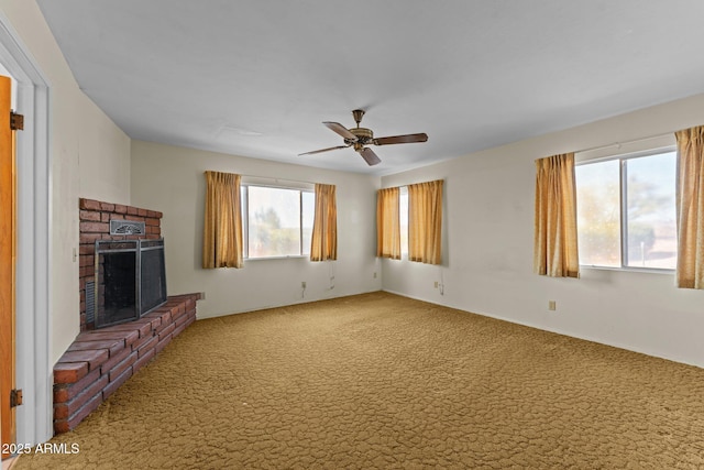 1455 W Kenrick Dr, Wickenburg, AZ 85390 - unfurnished living room featuring carpet flooring, ceiling fan, and a fireplace