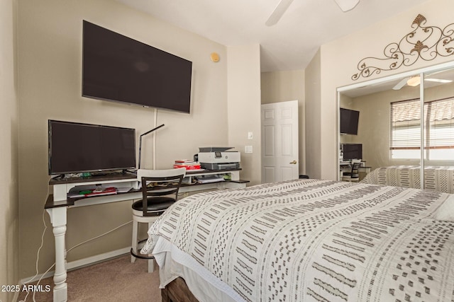 bedroom featuring a ceiling fan and carpet