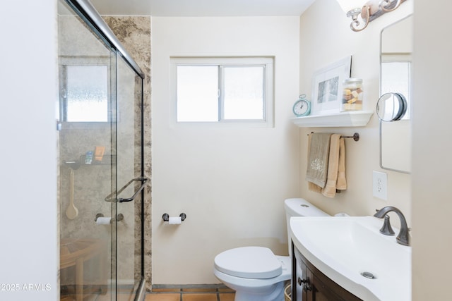 bathroom featuring tile patterned floors, toilet, walk in shower, and vanity