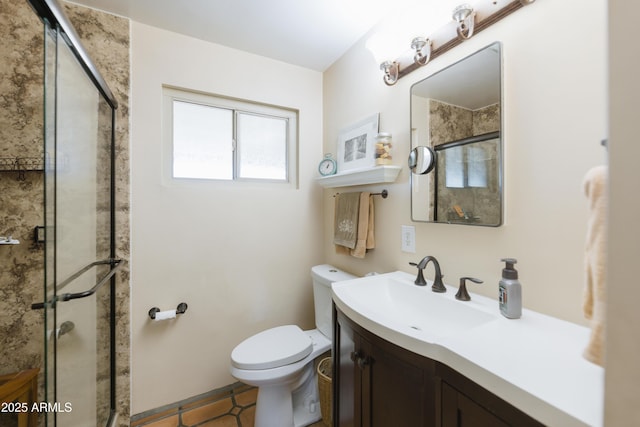 bathroom with toilet, tile patterned flooring, a shower with shower door, and vanity