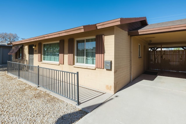 view of home's exterior with a carport