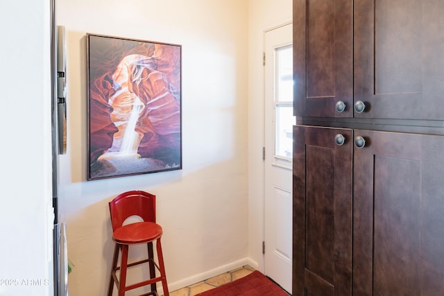 entryway featuring tile patterned floors and a healthy amount of sunlight