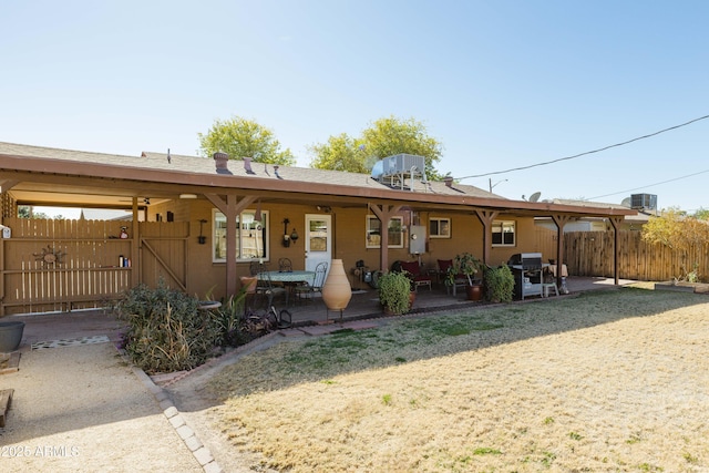 back of property featuring a patio area and cooling unit