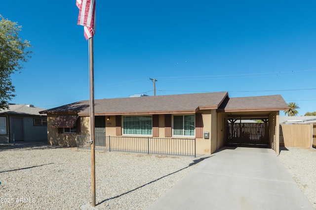 ranch-style home featuring a carport