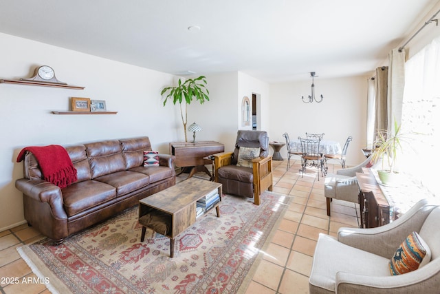 living room featuring light tile patterned floors and a chandelier