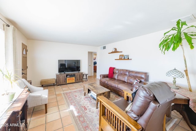 living room featuring light tile patterned flooring