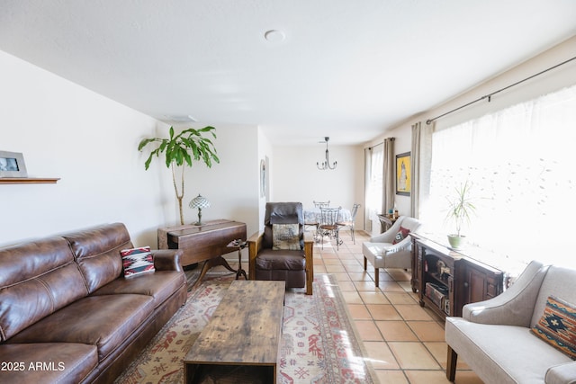 living room with light tile patterned flooring and a chandelier