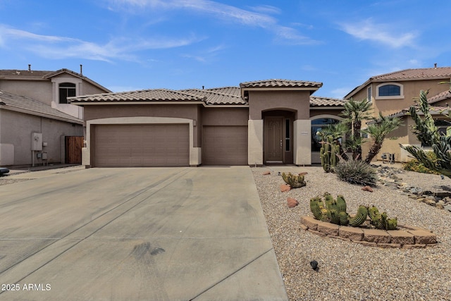 34944 N Mirandesa Dr, San Tan Valley, AZ 85143 - mediterranean / spanish house with a garage, concrete driveway, stucco siding, and a tiled roof