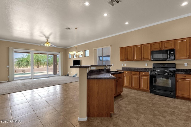 34944 N Mirandesa Dr, San Tan Valley, AZ 85143 - kitchen with black appliances, a chandelier, dark countertops, a sink, and open floor plan