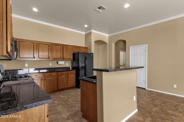 34944 N Mirandesa Dr, San Tan Valley, AZ 85143 - kitchen with black appliances, crown molding, a center island, tile patterned flooring, and brown cabinets