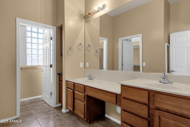 34944 N Mirandesa Dr, San Tan Valley, AZ 85143 - bathroom featuring double vanity, tile patterned flooring, and baseboards