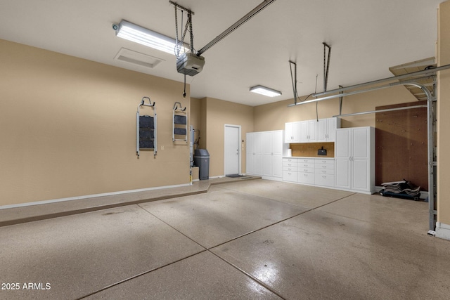 34944 N Mirandesa Dr, San Tan Valley, AZ 85143 - garage featuring baseboards and a garage door opener