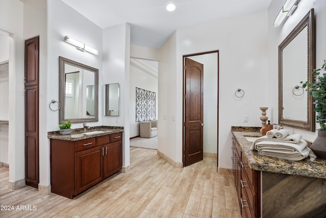 bathroom with hardwood / wood-style floors and vanity