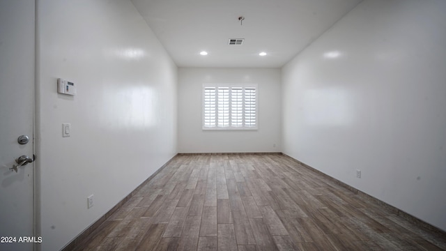 empty room with wood-type flooring