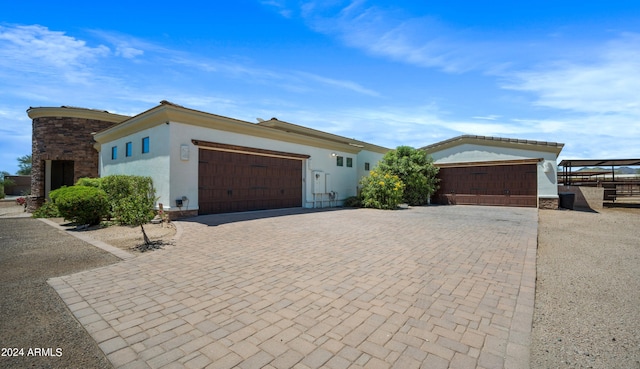 single story home with a garage