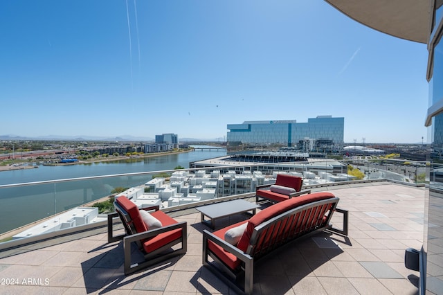 view of patio / terrace featuring a balcony and a water view